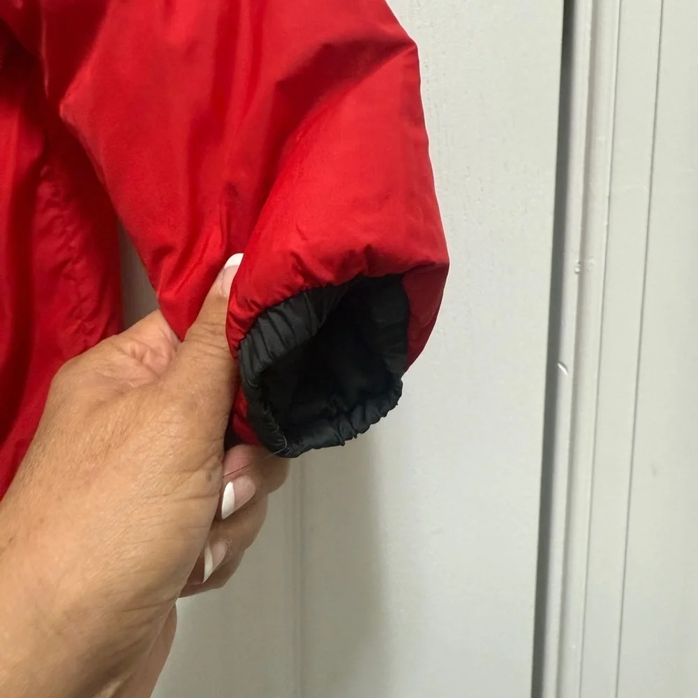 The North Face Kids Black and Red Puffer Jacket. Two-sided black and red